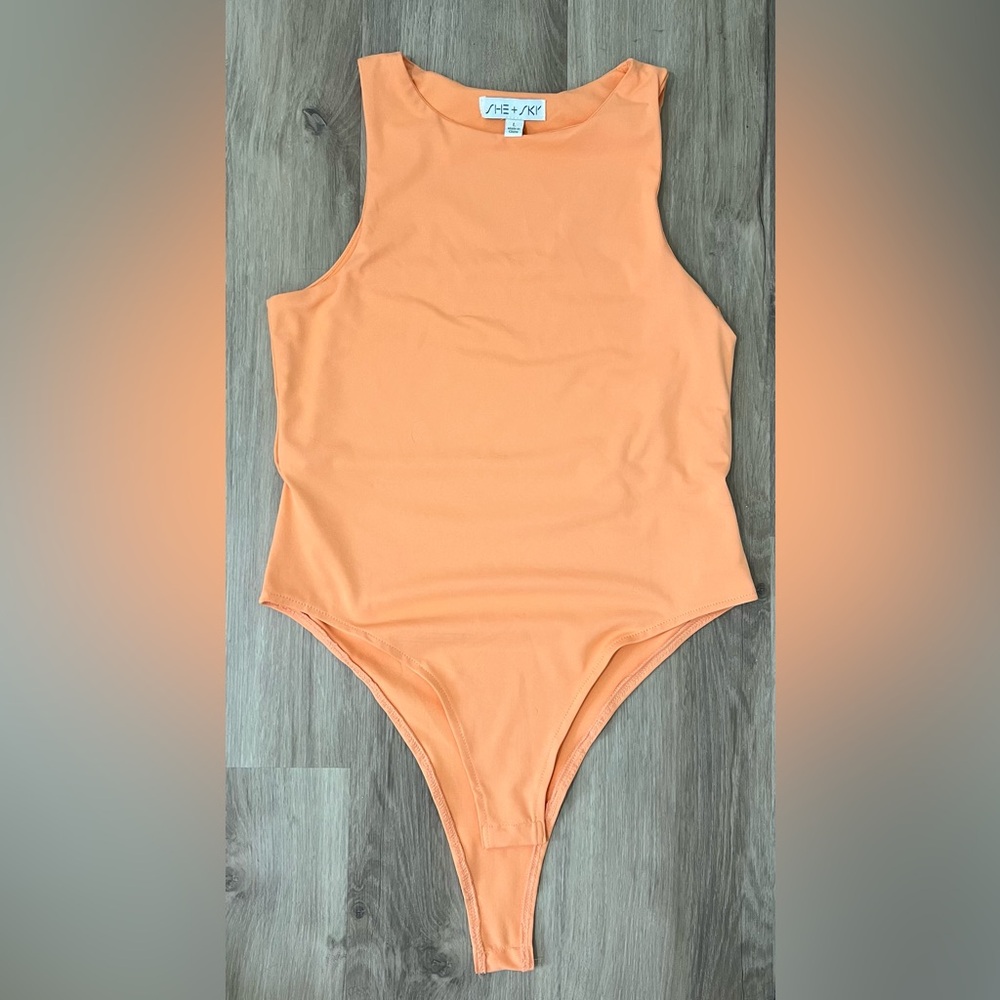 She and Sky- Orange sherbet- Body Suit- size Large- fits like medium